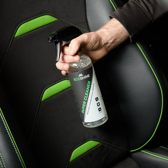 Image showing a man cleaning an interior of a car